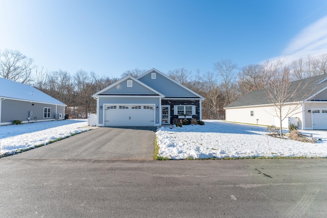 view of front of home featuring a garage and driveway