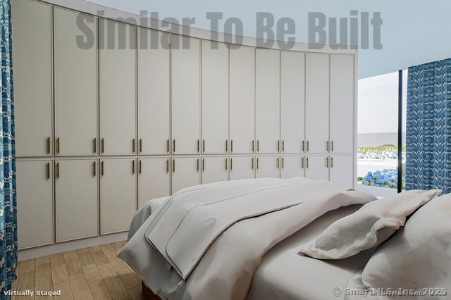 bedroom featuring light wood finished floors