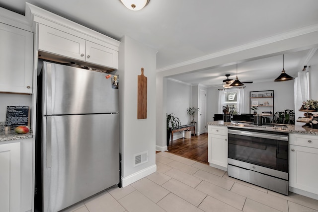 kitchen featuring white cabinetry, visible vents, and stainless steel appliances