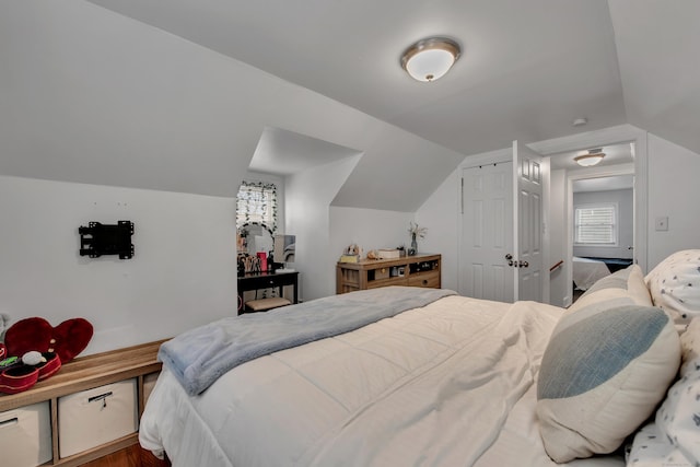 bedroom with lofted ceiling