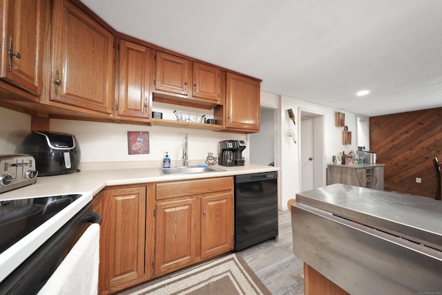 kitchen with dishwasher, light countertops, a sink, and brown cabinets