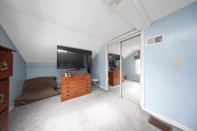 bedroom featuring baseboards, visible vents, a closet, and light colored carpet