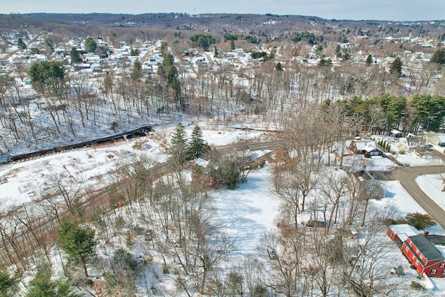 snowy aerial view with a residential view