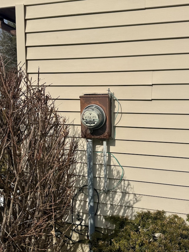 exterior details featuring electric meter