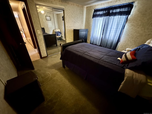 carpeted bedroom featuring a closet