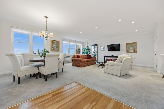 dining room with recessed lighting, light colored carpet, crown molding, and baseboards