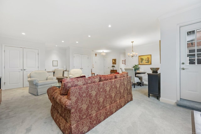 living room featuring ornamental molding, recessed lighting, a chandelier, and light colored carpet