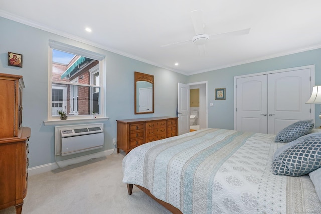 bedroom featuring ornamental molding, a closet, light carpet, and baseboards