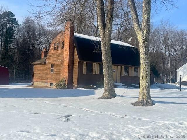 view of front of home featuring a chimney