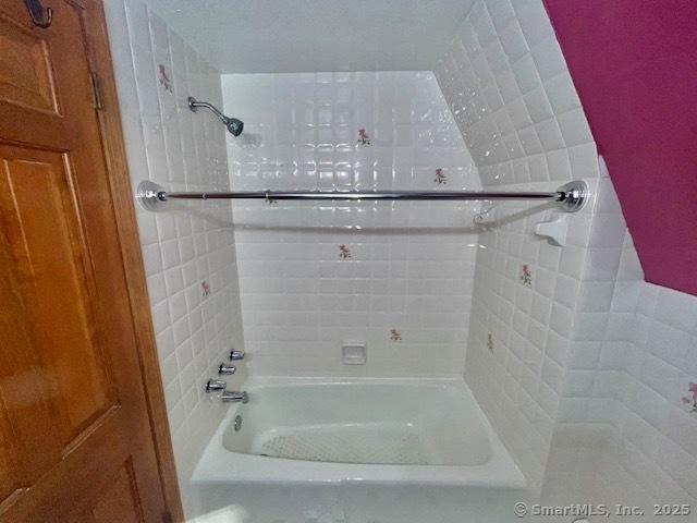 full bath featuring shower / tub combination