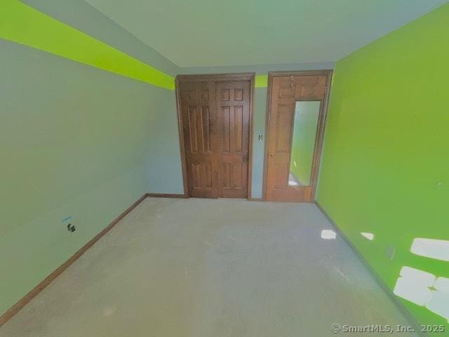 unfurnished bedroom featuring baseboards