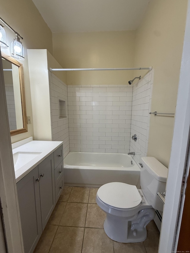 bathroom with toilet, tile patterned floors, bathing tub / shower combination, and vanity