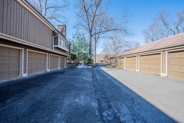 view of road with community garages