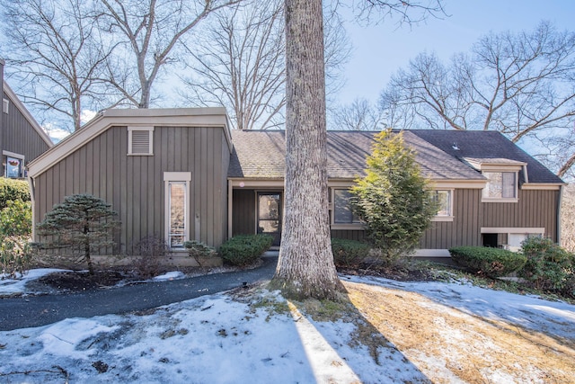 view of front of home featuring a shingled roof