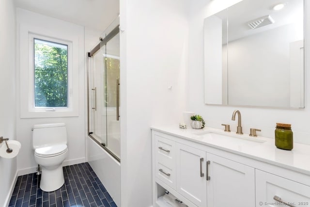 full bath featuring tile patterned flooring, toilet, bath / shower combo with glass door, visible vents, and vanity