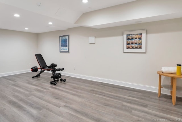 exercise room featuring recessed lighting, baseboards, and wood finished floors