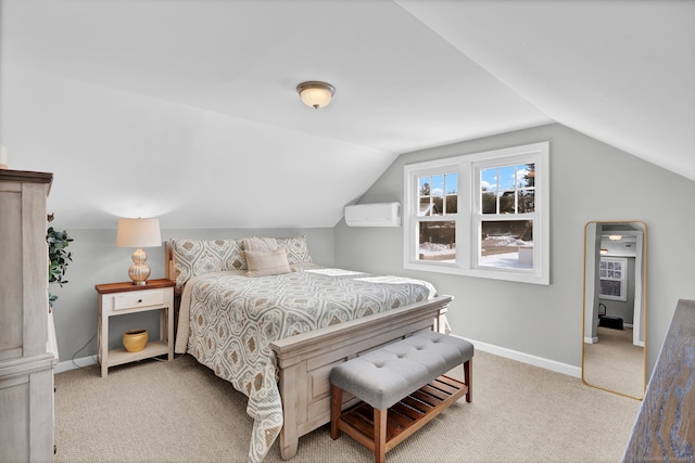 carpeted bedroom with an AC wall unit, vaulted ceiling, and baseboards