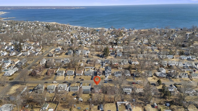 drone / aerial view with a residential view and a water view