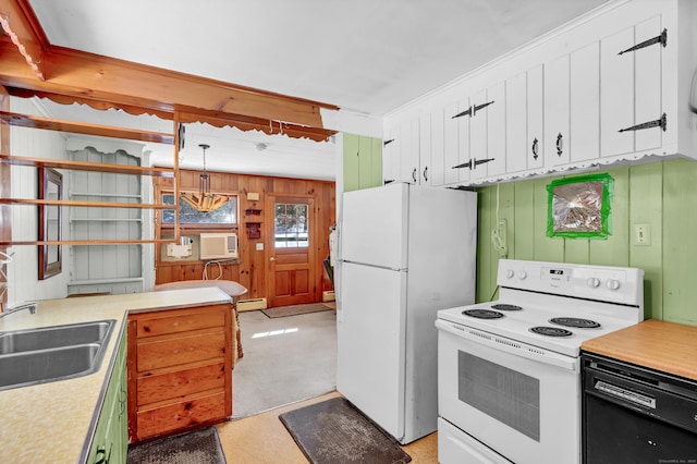 kitchen with white appliances, light countertops, a sink, and white cabinetry