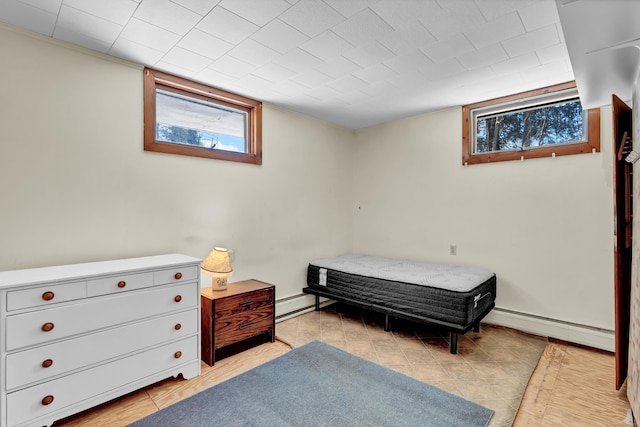 bedroom with a baseboard radiator and baseboard heating