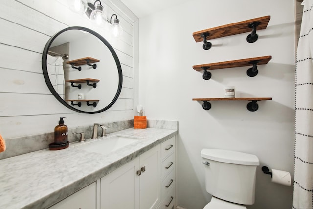 full bath featuring toilet and vanity