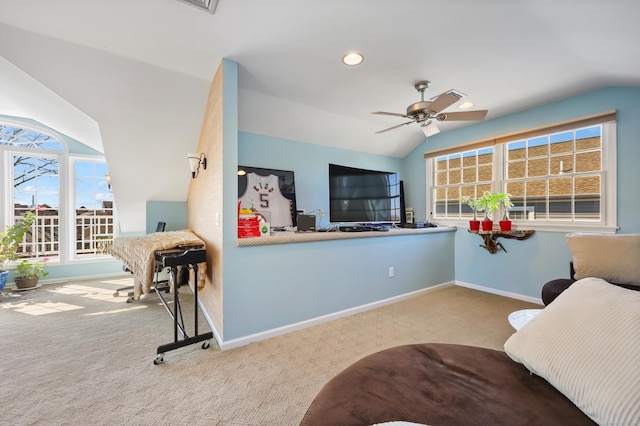 living room featuring carpet, vaulted ceiling, and baseboards