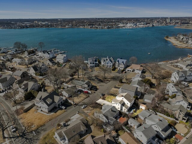 birds eye view of property with a residential view and a water view