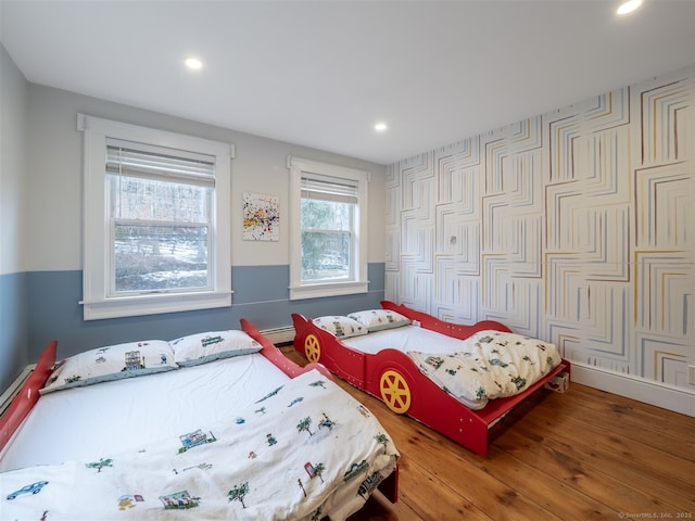 bedroom featuring wood finished floors and recessed lighting