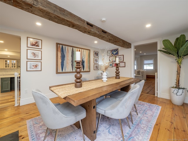 dining area with beamed ceiling, light wood-type flooring, and recessed lighting