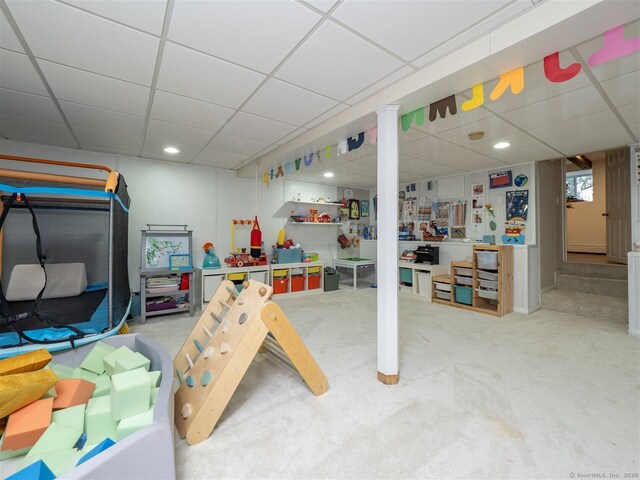 playroom with recessed lighting, a drop ceiling, and carpet flooring