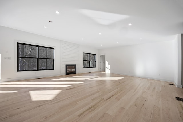 1600 S Main St, Cheshire, CT 06410 - unfurnished living room with baseboards, visible vents, light wood-type flooring, a fireplace, and recessed lighting