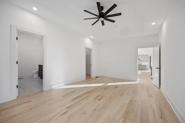 1600 S Main St, Cheshire, CT 06410 - spare room with a tray ceiling, recessed lighting, and light wood-style floors