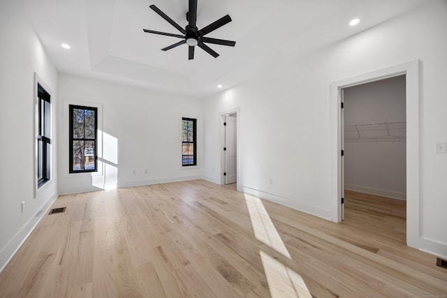 1600 S Main St, Cheshire, CT 06410 - unfurnished bedroom featuring light wood-type flooring, a raised ceiling, visible vents, and baseboards