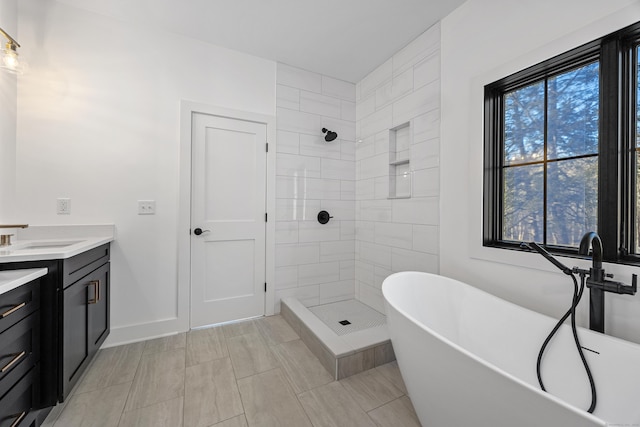 1600 S Main St, Cheshire, CT 06410 - bathroom with a freestanding bath, a shower stall, vanity, and baseboards