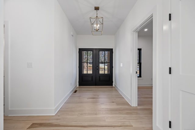 1600 S Main St, Cheshire, CT 06410 - entryway with french doors, baseboards, a notable chandelier, and light wood finished floors