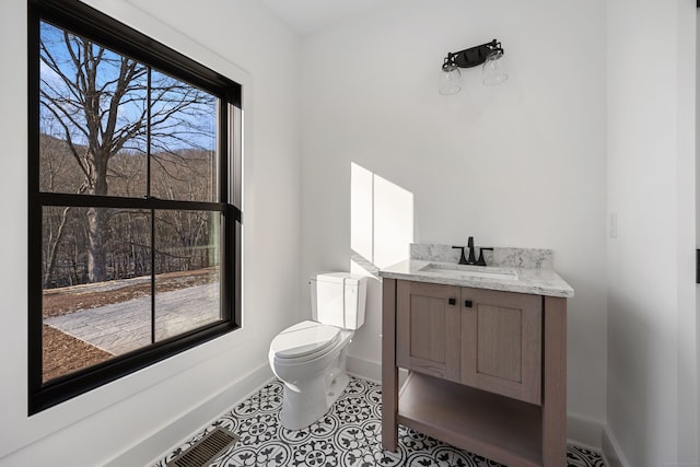 1600 S Main St, Cheshire, CT 06410 - bathroom with toilet, tile patterned flooring, baseboards, and vanity