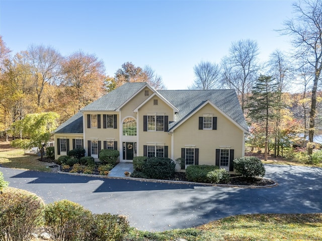 colonial home featuring driveway