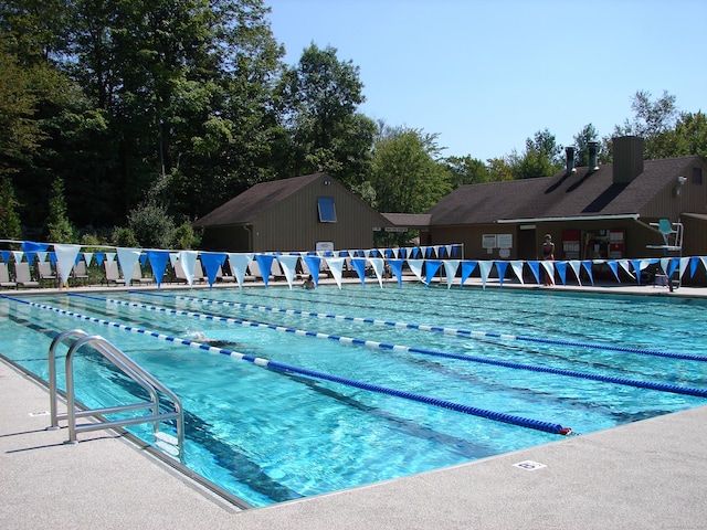 community pool featuring a patio area