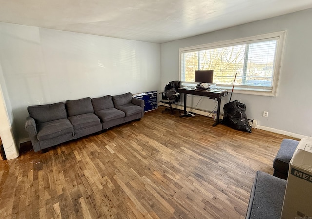 office area featuring wood finished floors and baseboards