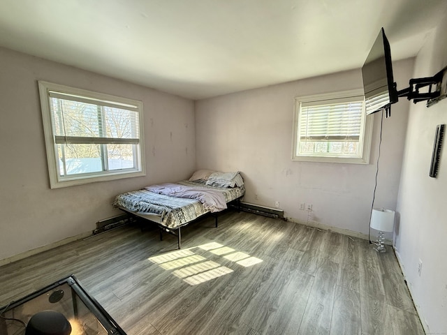 unfurnished bedroom featuring light wood finished floors and multiple windows