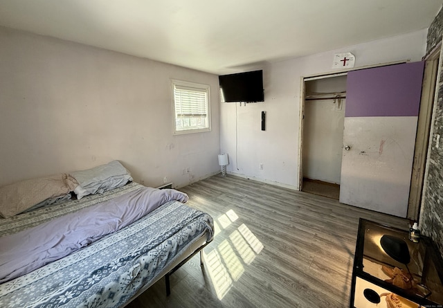 bedroom featuring a closet and wood finished floors