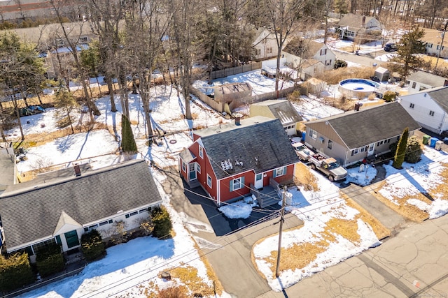 snowy aerial view featuring a residential view