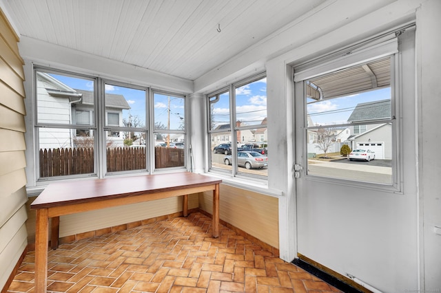 sunroom / solarium with wood ceiling