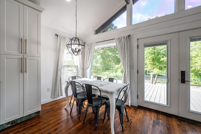 dining room featuring high vaulted ceiling, dark wood-type flooring, a notable chandelier, and french doors