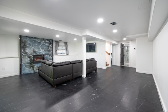 living area featuring recessed lighting, stairway, baseboards, and a premium fireplace