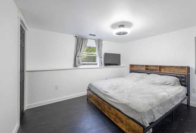 bedroom with visible vents and baseboards