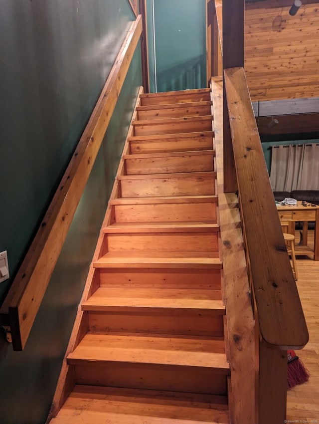 staircase with wood finished floors