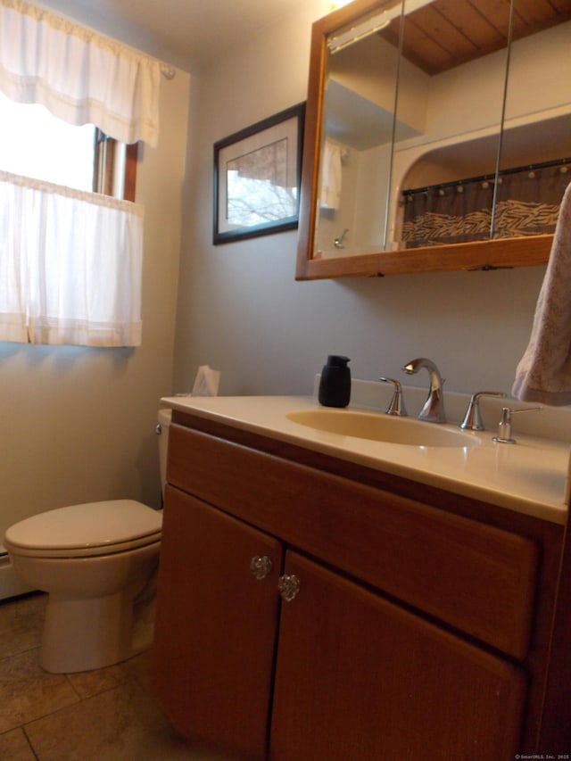 full bathroom with tile patterned flooring, vanity, and toilet