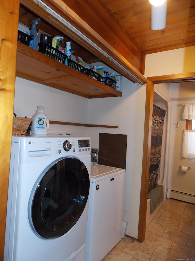 laundry room featuring laundry area, a baseboard heating unit, and independent washer and dryer