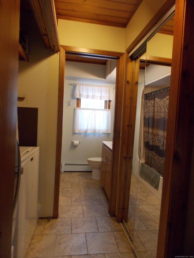 bathroom with wooden ceiling, toilet, vanity, and baseboard heating